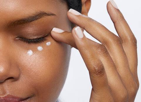 Woman Applying Eye Cream