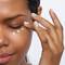 Woman Applying Eye Cream