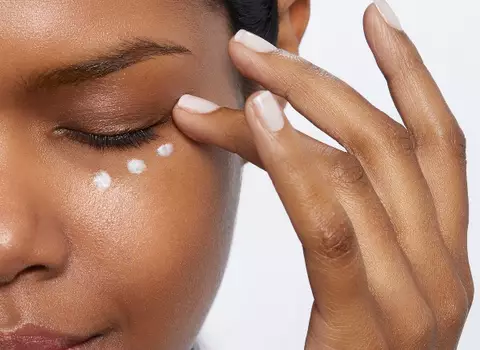 Woman Applying Eye Cream