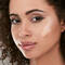 A photo of a woman with some makeup colors on face