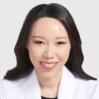 A close-up photo of Dr. Julia Tzu's face.