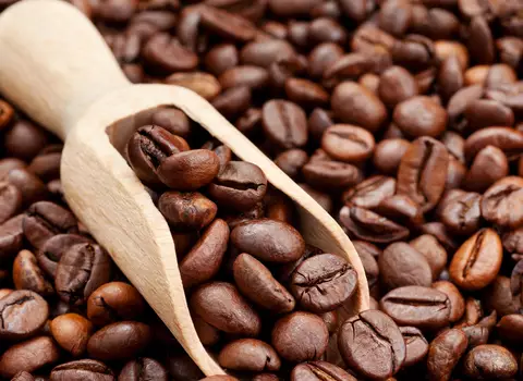 A photo of coffee beans and how caffeine can be great for your skin
