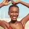 A woman smiling with a summer glow