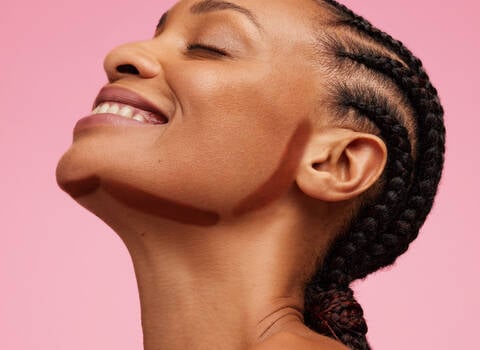 A photo of a woman with contouring makeup around her jawline