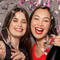 A photo of a women smiling at a party