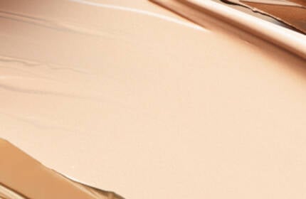 Banner image with pink background showing skincare product dropper
