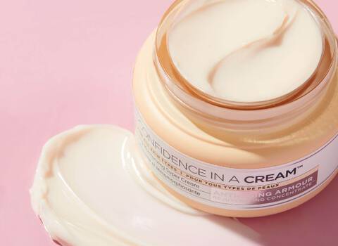 Jar of Face Cream with Pink Background