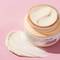 Jar of Face Cream with Pink Background