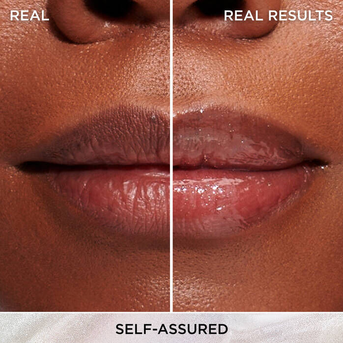 A close-up photo of a woman's lips with a white line down the middle of the image. The lips don't have any product on the left side of the line, and on the right side is IT Cosmetics Confidence in a Serum Lip Gloss in the shade "Self-Assured."