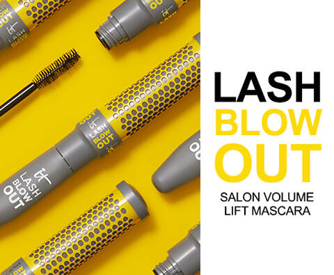 A photo of several tubes of IT Cosmetics Lash Blow Out mascara next to the text "Lash Blow Out. Salon volume lift mascara."