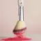 A photo of a makeup brush