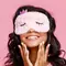 A woman with a kitty sleep mask on