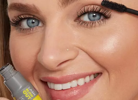A photo of a woman using mascara