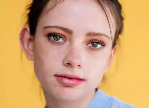 A close up photo of a woman's face