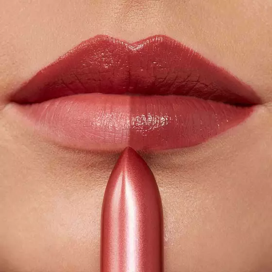 A close up image of a woman's lips before and after lipstick application