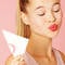 A model blotting their lipstick on a napkin