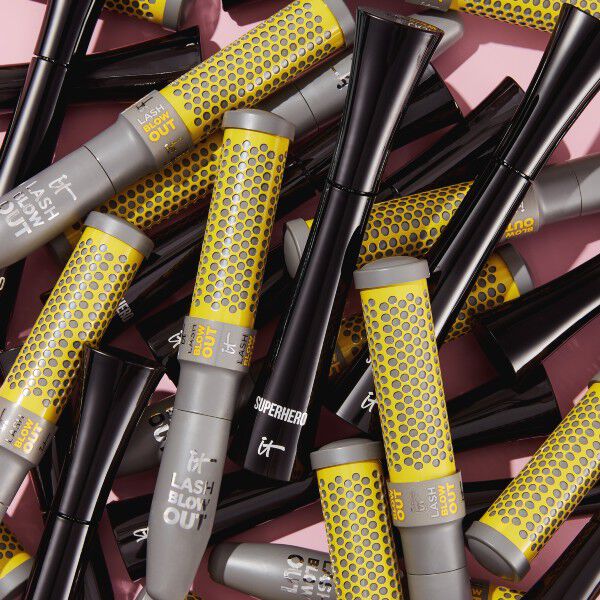 Image of a collage of grey and yellow mascara tubes.