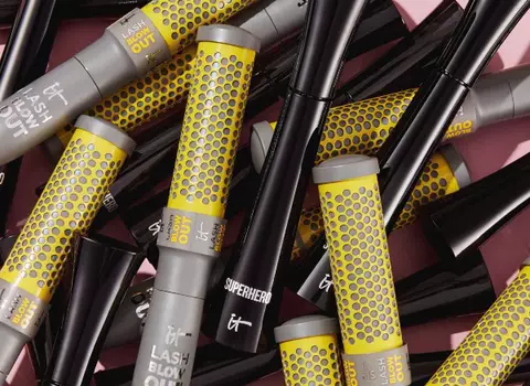 Image of a collage of grey and yellow mascara tubes.