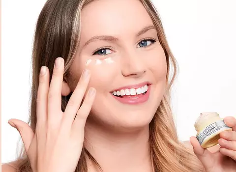 Woman with Blonde Hair Applyingi Eye Cream
