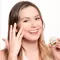 Woman with Blonde Hair Applyingi Eye Cream