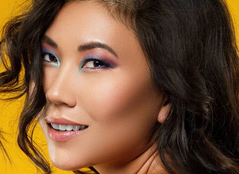 A photo of a woman with highlighting foundation on