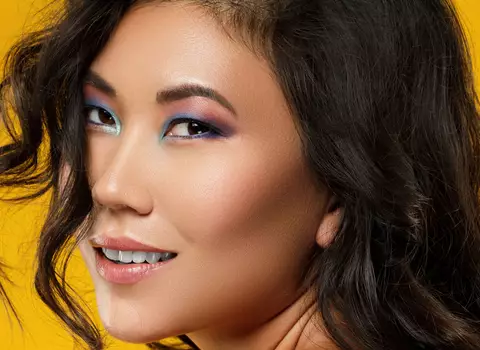A photo of a woman with highlighting foundation on