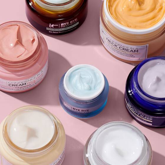 Arrangement of IT Cosmetics Bye Bye Redness, Confidence in a Neck Cream, Bye Bye Under Eye and other face creams